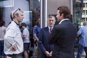 M 322 (Left to right.) Director Neil Burger reviews a scene with star Robert De Niro and Bradley Cooper on the set of Relativity Media's LIMITLESS.