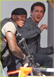 June 17th 2010 Los Angeles, California. ***WORLD EXCLUSIVE*** The very first photos of Shia LaBeouf and Rosie Huntington Whiteley filming Transformers 3. Director Michael Bay and actor Tyreese also photographed. This thrilling action scene involves Shia and Rosie being chased by an evil Decepticon Transformer and the US military trying to fend off the evil robot. As Shia and Rosie run for safety through an office building, the Decepticon tips the building over. For this scene one floor of an office building was built on a giant platform that tilts to an angle. All cast and crew appeared to be very happy working together and very focused on creating the "greatest action film of all time". Later in the day, while filming continued, a big satellite TV was brought on the set to air the live championship game between the Los Angeles Lakers and the Boston Celtics. Everyone stopped working to watch the final few minutes of the exciting game. When the Lakers won, there were wild cheers and applause by most people on set including big Laker fan, Shia LaBeouf. Photo by Eric Ford/ On Location News. 818 613 3955 info@onlocationnews.com