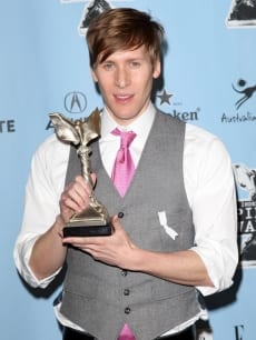86740 dustin lance black poses with his award for best first screenplay for milk at the 24th annual film i